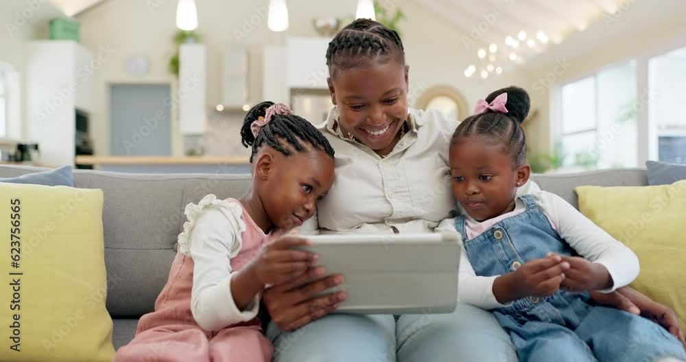 Happy, mother with her girl child and tablet on sofa in living room of their home together. Technology or connectivity, learning or kissing and black family on couch streaming a movie in their house Happy, mother with her girl child and tablet on sofa in living room of their home together. Technology or connectivity, learning or kissing and black family on couch streaming a movie in their house