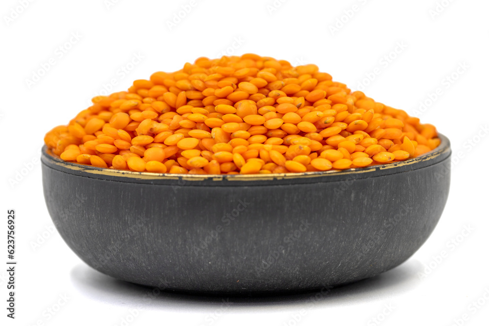 Red lentils isolated on white background. Raw red lentils in bowl. Close up Red lentils isolated on white background. Raw red lentils in bowl. Close up