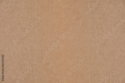 Abstract, solid brown cardboard background. © freeman83
