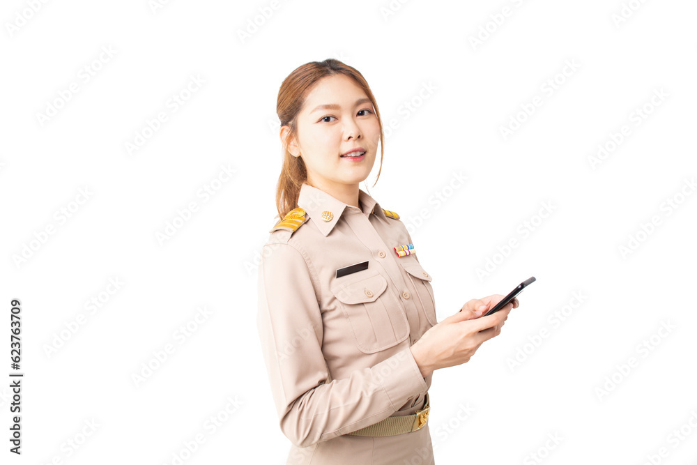Female Thai government officer in khaki uniforms smiling and standing typing smartphone on white background. Cheerful beautiful asian woman connecting internet for shopping online and surfing. Female Thai government officer in khaki uniforms smiling and standing typing smartphone on white background. Cheerful beautiful asian woman connecting internet for shopping online and surfing.