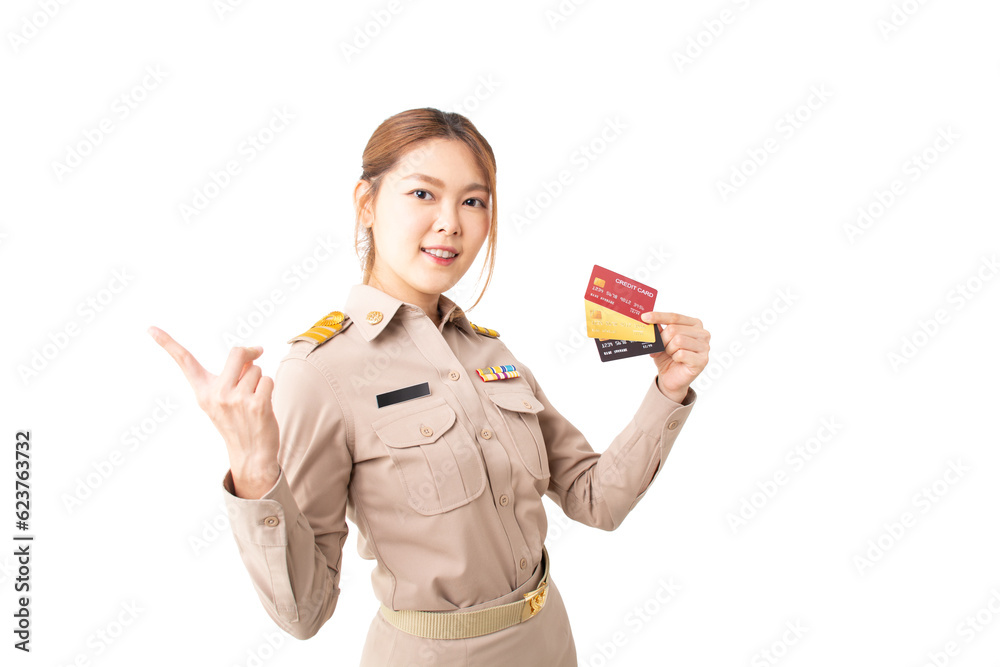 Female Thai government officer in khaki uniforms pointing side to product or copy space on white background. Asian woman holding credit cards. Concept of payment purchase, financial, transaction. Female Thai government officer in khaki uniforms pointing side to product or copy space on white background. Asian woman holding credit cards. Concept of payment purchase, financial, transaction.
