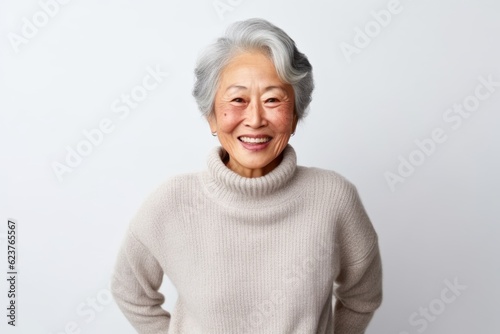 Portrait of happy senior asian woman smiling with white background.