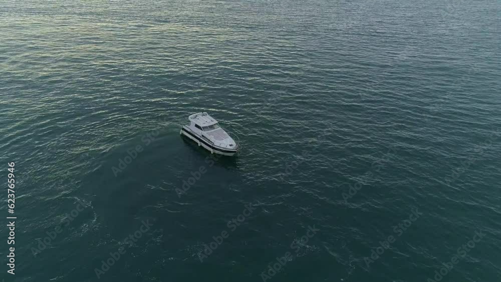 One ship boat in beautiful nature ocean landscape. A sailing yacht cruising on the sea. deep-sea fishing. travel and recreation on the high seas One ship boat in beautiful nature ocean landscape. A sailing yacht cruising on the sea. deep-sea fishing. travel and recreation on the high seas
