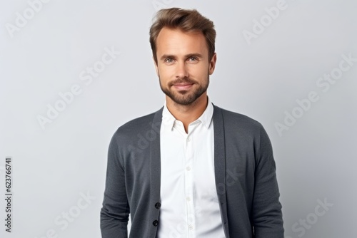 Portrait of handsome young man in casual clothes looking at camera.