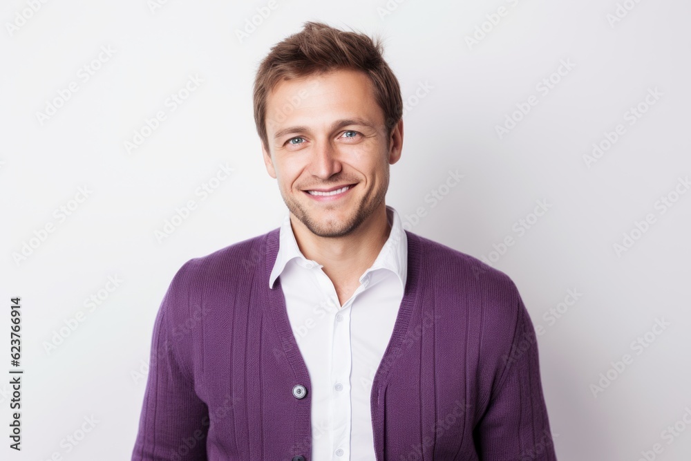 Portrait of a handsome young man in purple jacket on white background Portrait of a handsome young man in purple jacket on white background