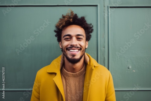 Portrait photography of a happy Brazilian man in his 20s wearing a chic cardigan against an abstract background  photo