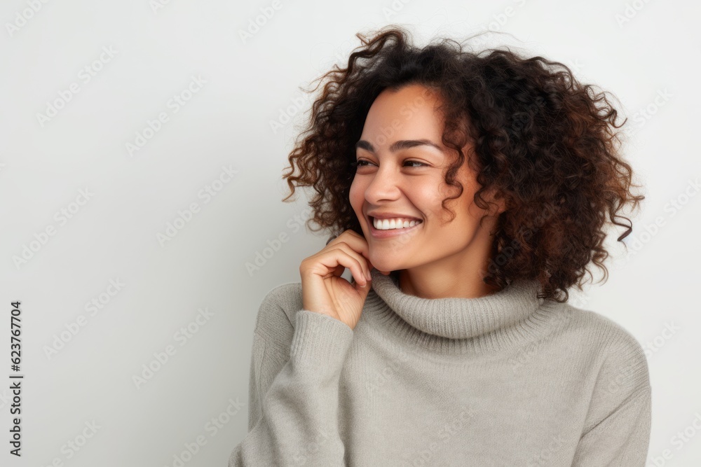 Portrait of a young beautiful african american woman smiling against white background Portrait of a young beautiful african american woman smiling against white background