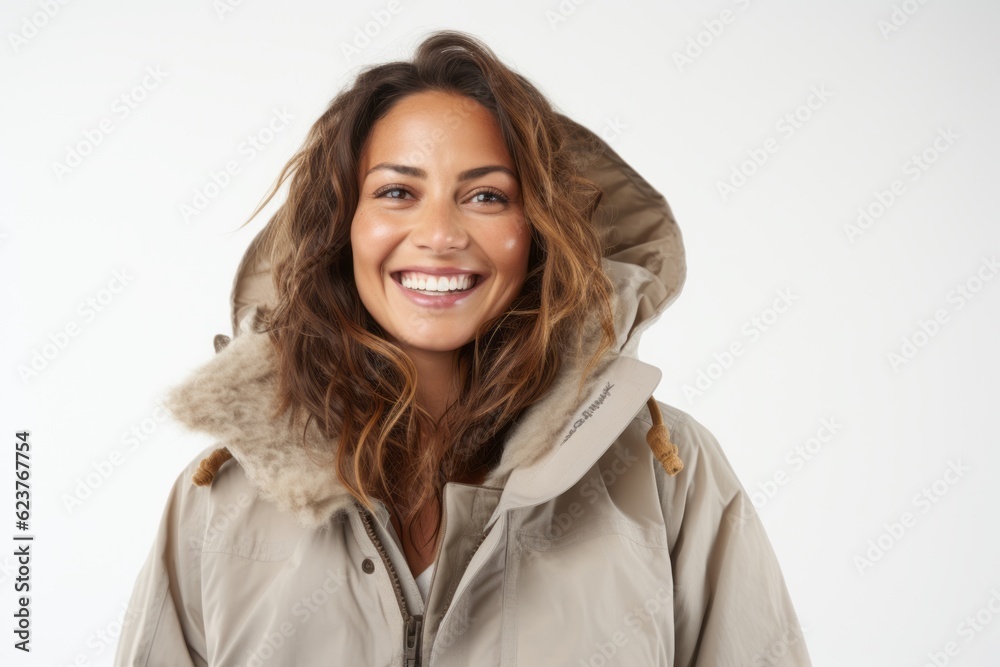 Close up portrait of a smiling young woman wearing winter jacket isolated on a white background Close up portrait of a smiling young woman wearing winter jacket isolated on a white background