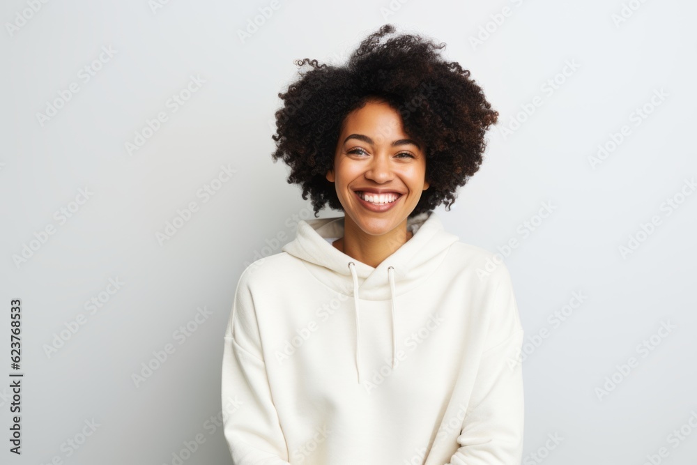 Portrait of a beautiful young african american woman smiling against white background Portrait of a beautiful young african american woman smiling against white background