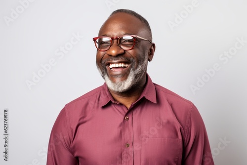 Portrait of a happy african american man wearing eyeglasses © Robert MEYNER