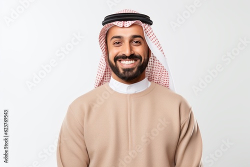 Portrait of a smiling arabian man in a sweatshirt isolated on a white background