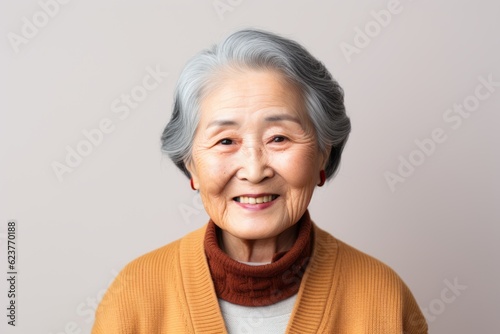 Portrait of happy senior asian woman looking at camera with smile