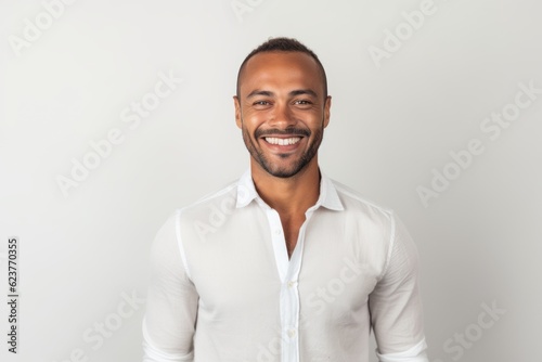 Portrait of a smiling african american man on white background © Robert MEYNER