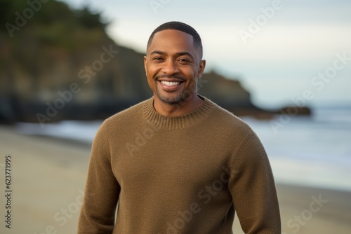 Portrait of a smiling african american man standing on the beach