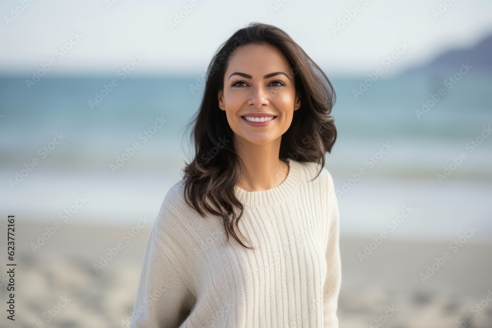 Portrait of smiling young woman on the beach at the day time Portrait of smiling young woman on the beach at the day time
