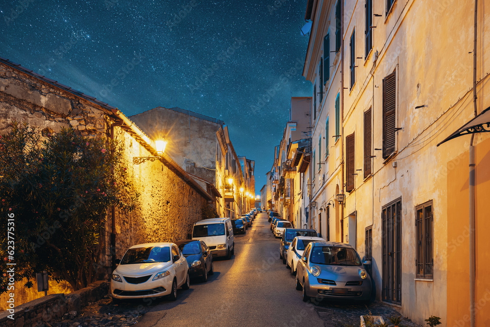 Fototapeta premium Cars Parked On Narrowm Street In European City In Summer Night.