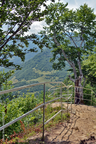 view of the mountains in the summer. observation deck on top of the mountain overlooking the village