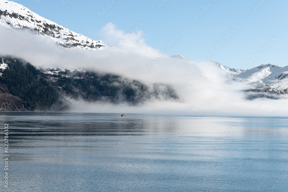 Fog on the mountains and sea in Passage Canal, Whittier, Alaska USA