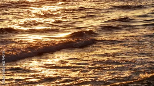 Ocean sunset on the golden waves photo