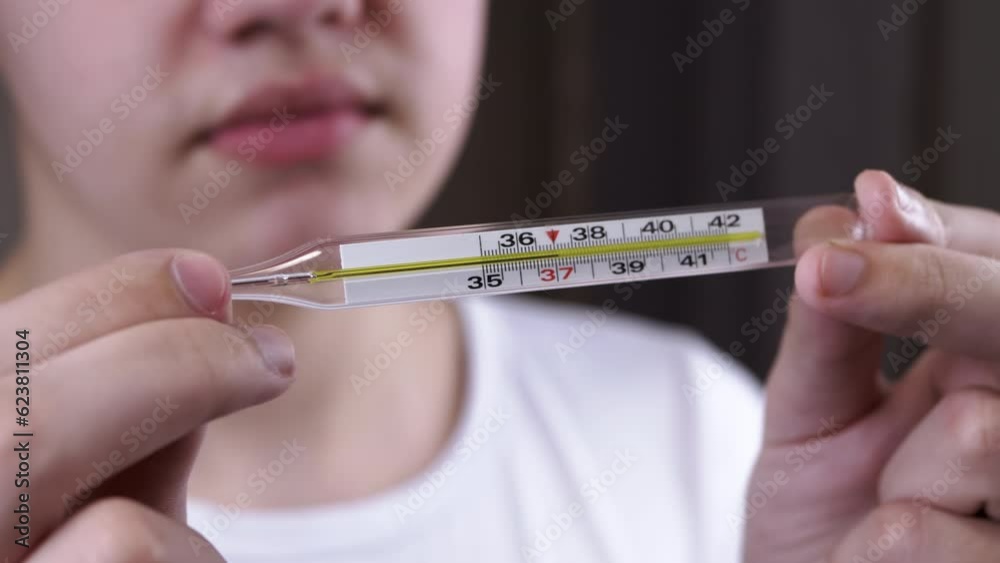 Vidéo Stock Sick Child Holding a Mercury Thermometer with Body