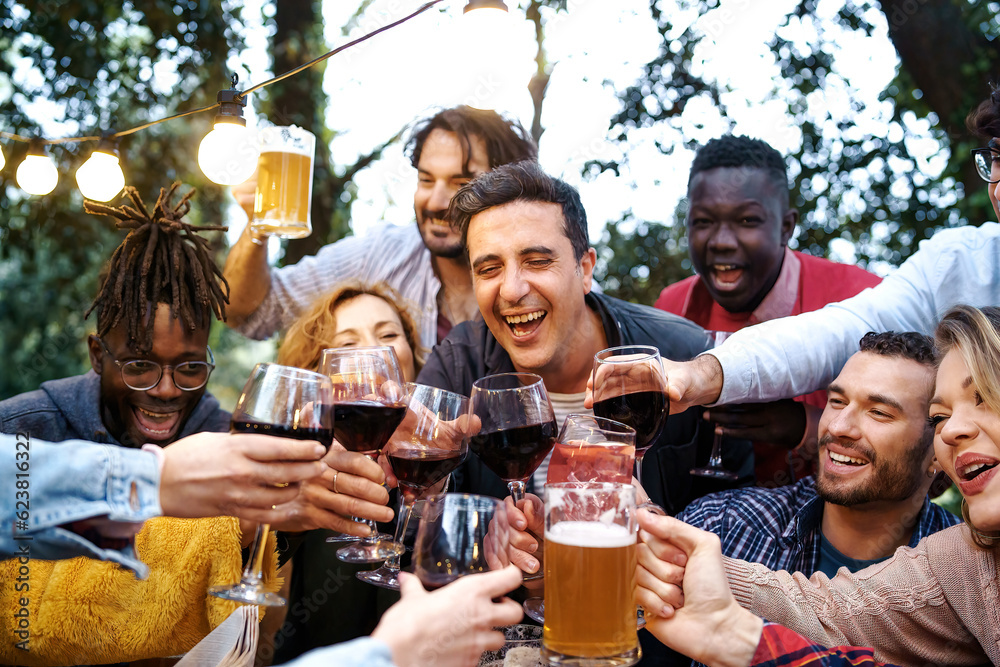 Friends Toasting at Countryside Gathering at Dusk - Diverse group of friends aged 20-40, toasting outdoors at a countryside house Friends Toasting at Countryside Gathering at Dusk - Diverse group of friends aged 20-40, toasting outdoors at a countryside house
