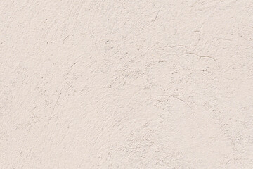 An old plaster cement wall, beige abstract background. Concrete grunge texture