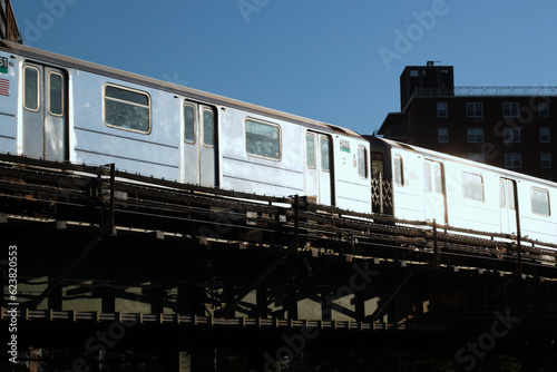 New York City elevated subway train reflecting bright morning sunshine photo