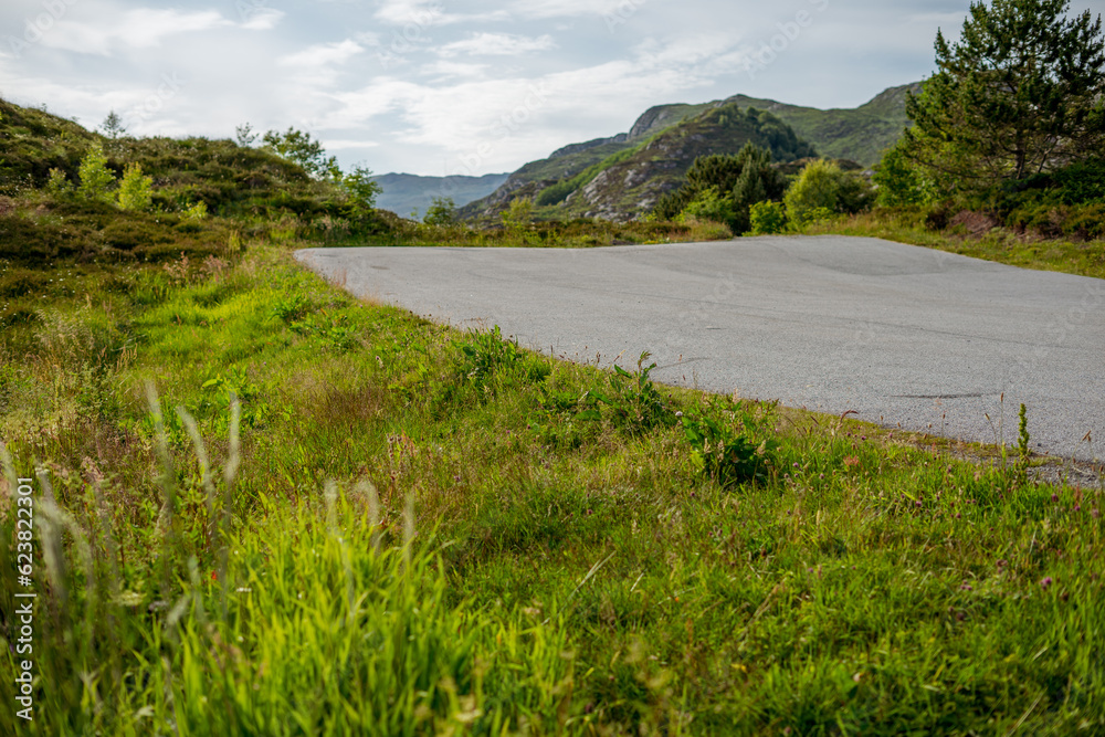 View of empty road leading to mountains daylight