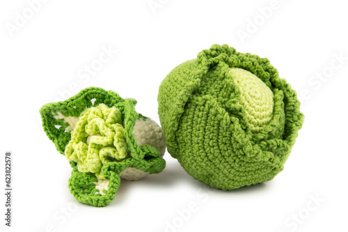 An artificial head of green and cauliflower knitted from thick yarn
