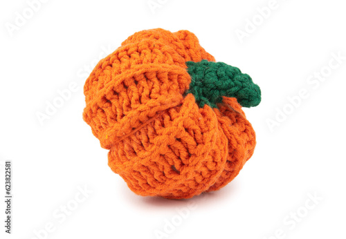 Artificial pumpkin with a green handle knitted from thick yarn