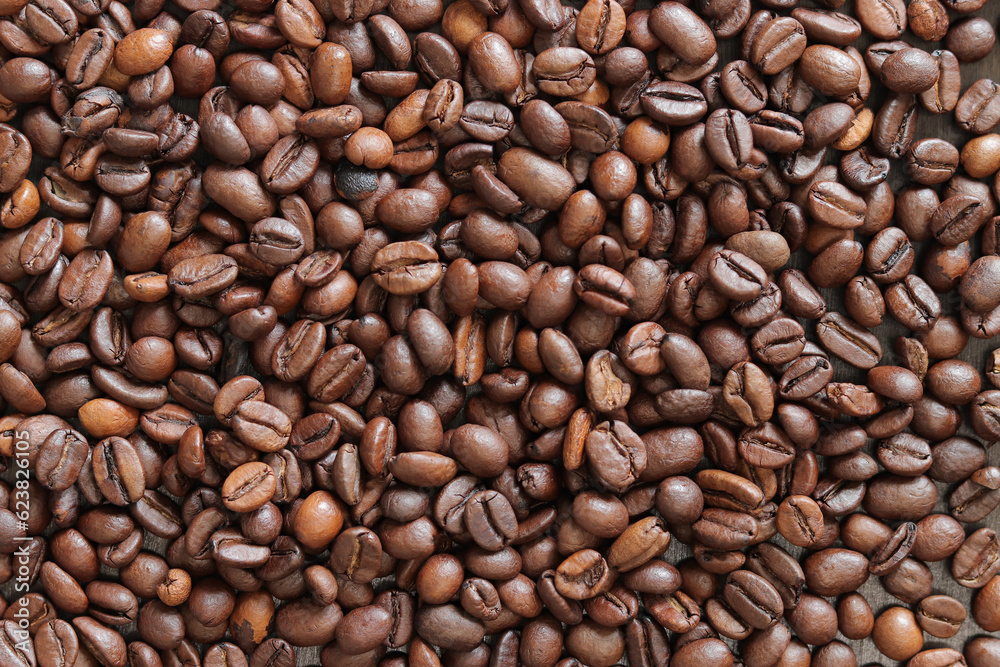 Top view of background representing halves of dark brown coffee beans. Roasted coffee beans, copy space Top view of background representing halves of dark brown coffee beans. Roasted coffee beans, copy space