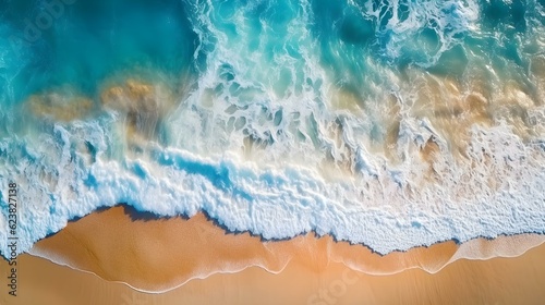 Aerial View of a Wave reaching a sandy Beach 