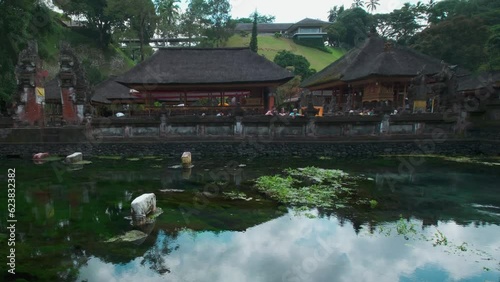 Tirta Empul temple is Hindu Balinese water temple in Bali Indonesia consists of a petirtaan or bathing structure, famous for its holy spring water photo