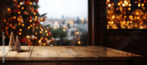 Empty wooden table for product display montages with Christmas tree in background