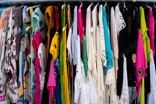 Closeup of colorful clothing garments at a street vendor in Europe photo