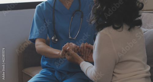 Close-up of stethoscope and paper on background of doctor and patient hands