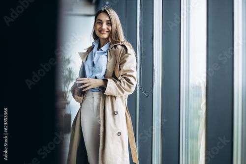 Free Download Business woman walking at the office building holding documents and folders - GFXLoad