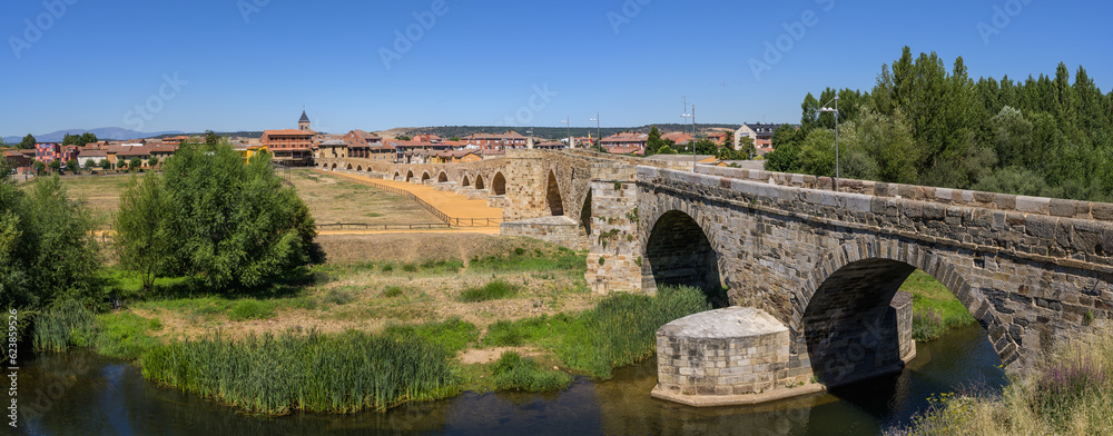 Summer's Awakening: Unveiling the Roman Bridge along the Camino de Santiago in Hospital de Orbigo, Leon, Spain