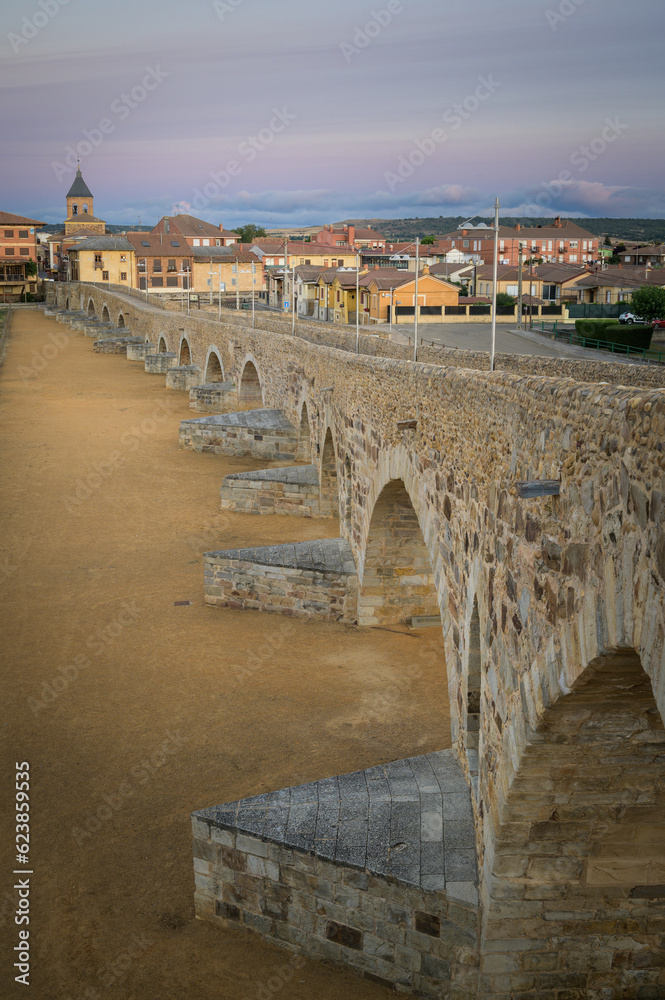 Summer's Awakening: Unveiling the Roman Bridge along the Camino de Santiago in Hospital de Orbigo, Leon, Spain