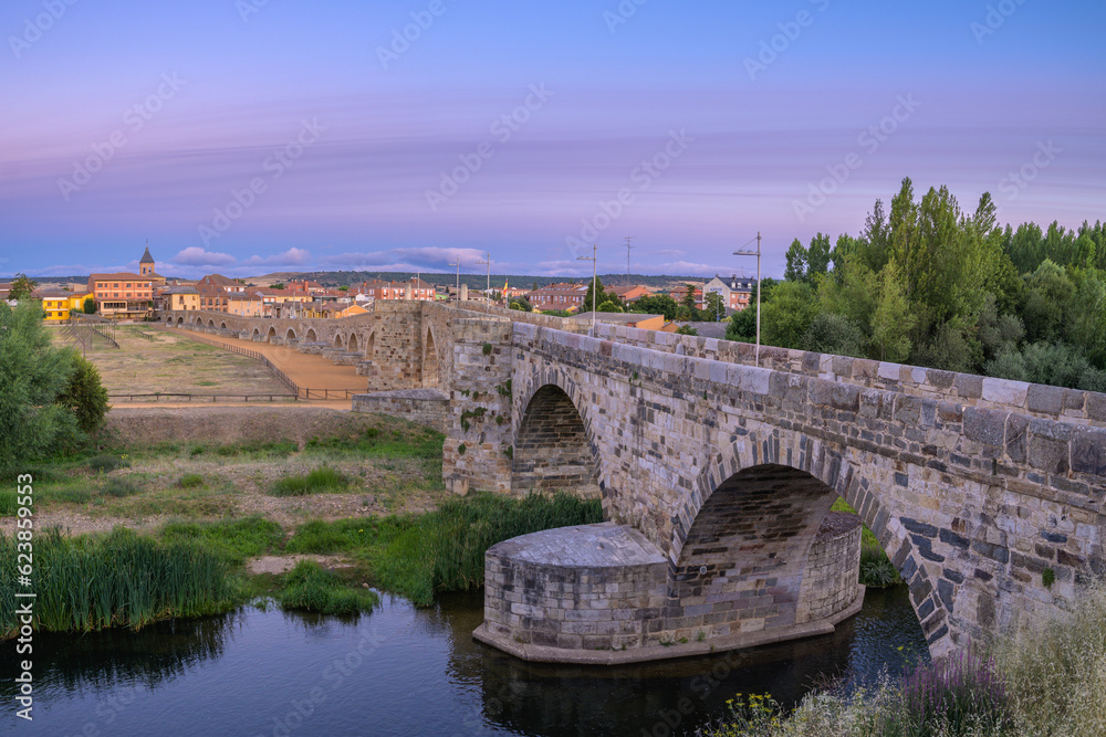 Summer's Awakening: Unveiling the Roman Bridge along the Camino de Santiago in Hospital de Orbigo, Leon, Spain