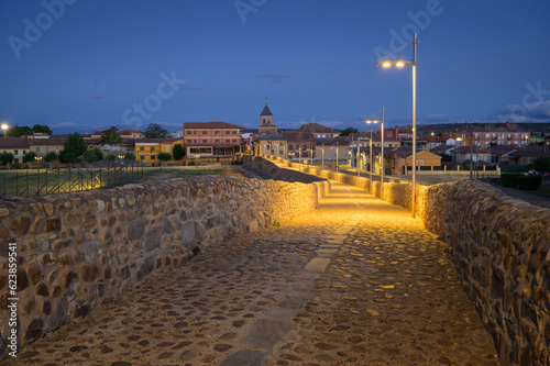 Obraz na płótnie Summer's Awakening: Unveiling the Roman Bridge along the Camino de Santiago in Hospital de Orbigo, Leon, Spain w salonie
