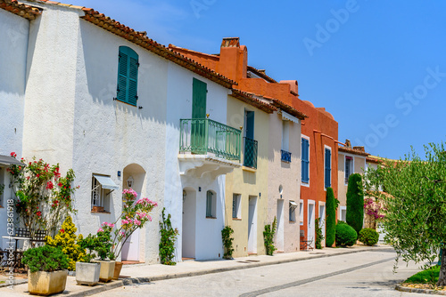 Fototapeta Naklejka Na Ścianę i Meble -  Colorful houses in Port Grimaud, village on Mediterranean sea with yacht harbour, Provence, summer vacation in France