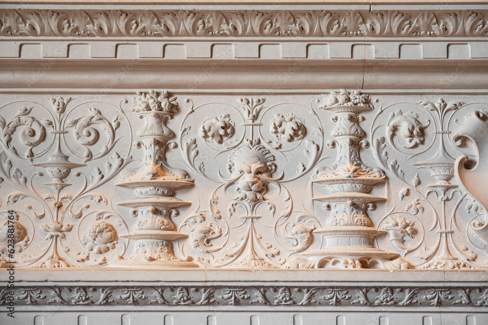 Detail of a bas-relief of a fireplace in an old house in France