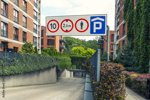 road sign in front of the entrance to the underground parking
