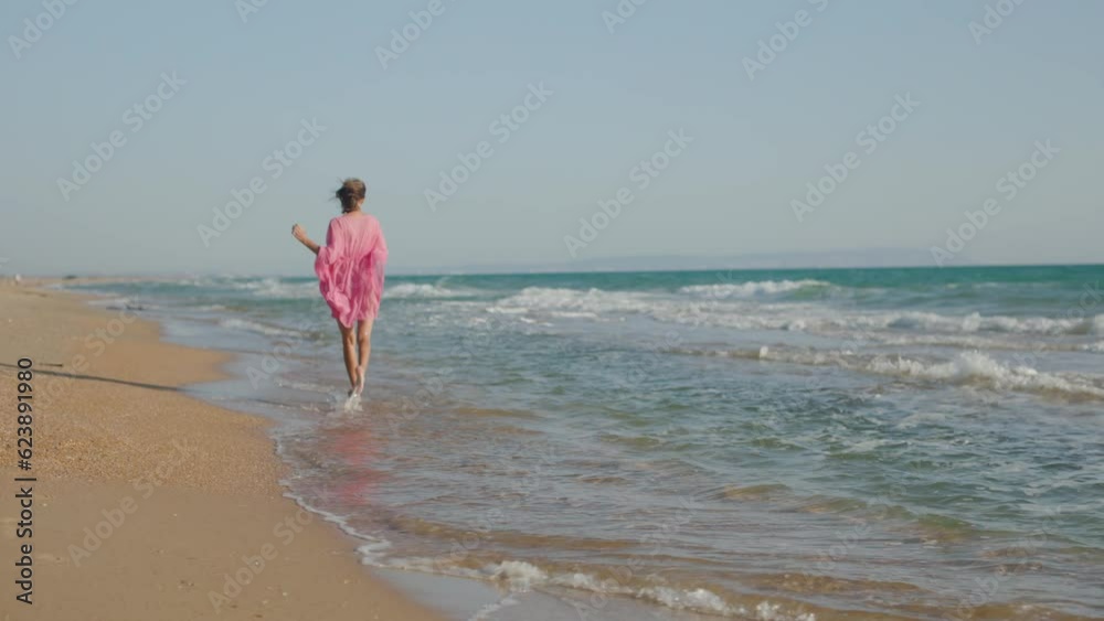 woman in a dress fun on the sandy seashore woman in a dress fun on the sandy seashore