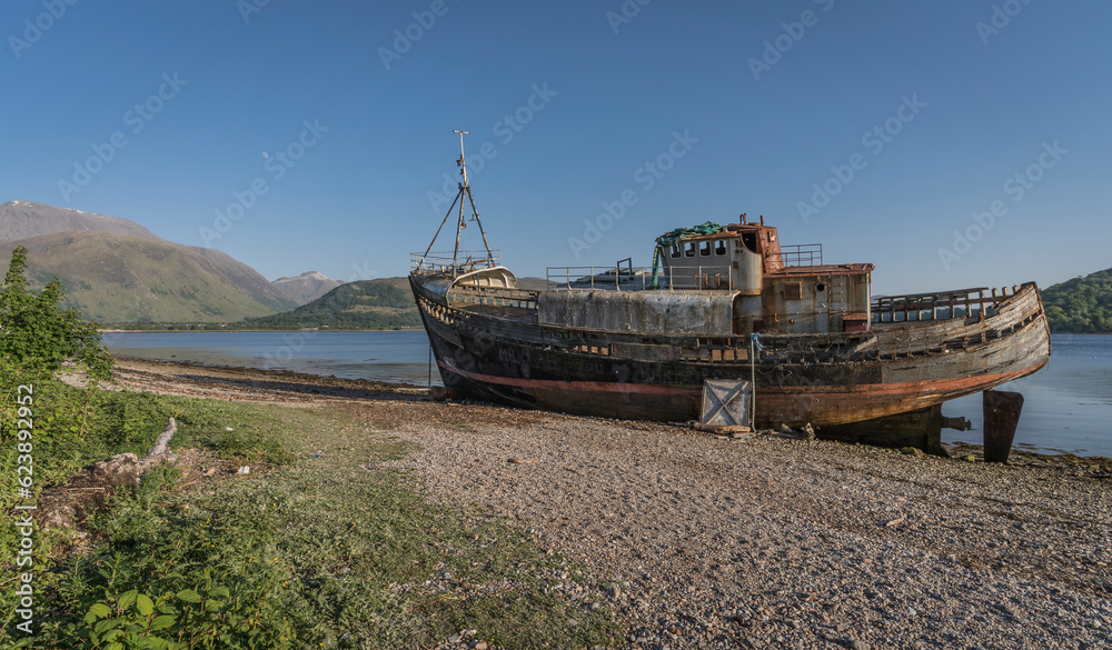 Abandoned fish trawler on the shore of Loch Linnhe.