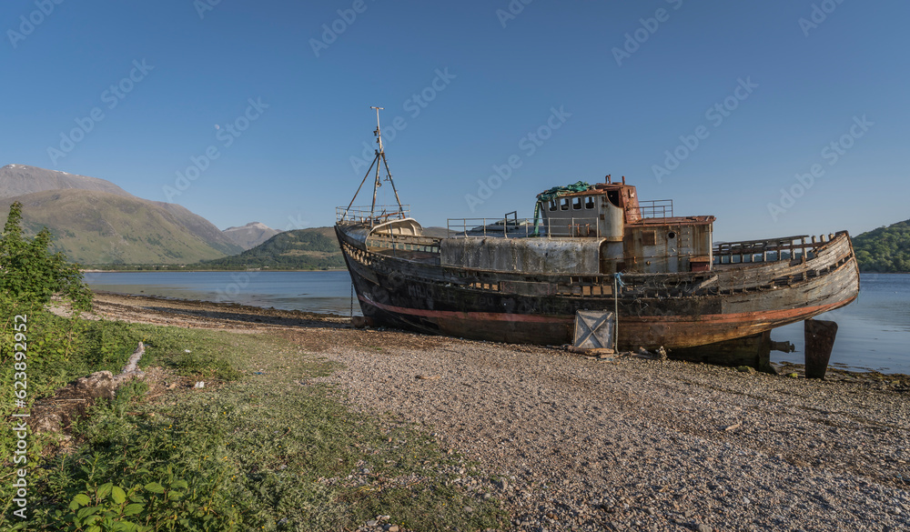 Abandoned fish trawler on the shore of Loch Linnhe. Abandoned fish trawler on the shore of Loch Linnhe.