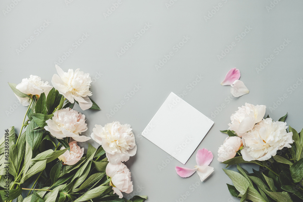 Greeting card with place for your text and white peonies top view