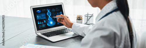 Doctor studying genetic disease in DNA research with laptop, analyze genetic data, formulate medical treatment strategies, and develop healthcare plan for patient with innovative solution. Neoteric