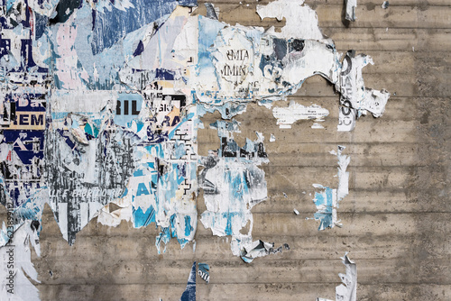 Wall with ripped posters